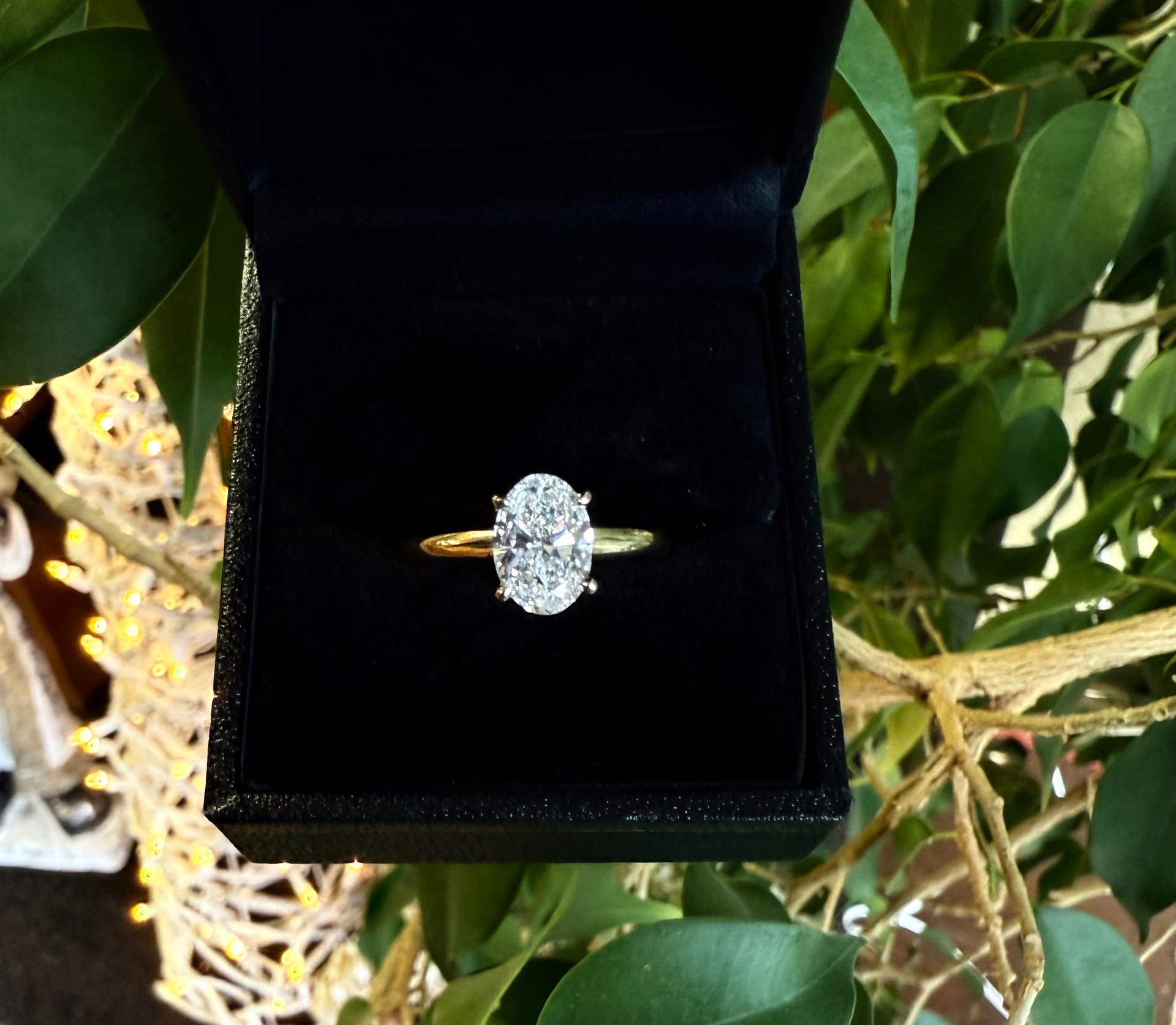 Oval diamond solitaire engagement ring in yellow gold